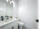 Bright powder room with white marble vanity, modern faucet, and well-lit mirror, perfect for guests at 601 Green Briar Blvd, Altamonte Springs, FL 32714