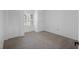 Empty bedroom features neutral carpet, window, and closet at 633 N Longview Pl, Longwood, FL 32779
