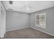 Bedroom with neutral carpet, a white ceiling fan, and a window providing ample natural light at 633 N Longview Pl, Longwood, FL 32779
