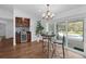 Cozy breakfast nook with wine bar and views of the screened-in pool and patio area at 633 N Longview Pl, Longwood, FL 32779