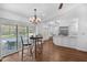 Bright breakfast nook with an adjacent kitchen featuring stainless steel appliances and a granite countertop island at 633 N Longview Pl, Longwood, FL 32779