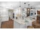 Bright kitchen features granite countertops, stainless appliances, and large island with seating at 633 N Longview Pl, Longwood, FL 32779