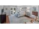 Inviting main bedroom with French doors to the pool area and connecting bathroom at 633 N Longview Pl, Longwood, FL 32779
