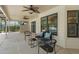 Covered patio with comfortable seating, ceiling fans, and access to the backyard and pool area at 633 N Longview Pl, Longwood, FL 32779