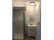 Bathroom with a vanity, framed mirror, and a glass enclosed shower, offering a clean design at 647 Madison Ave, Daytona Beach, FL 32114
