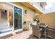Private outdoor patio with seating, brick pavers, built-in grill and easy indoor access at 7572 Sunny Dreams Ln, Kissimmee, FL 34747
