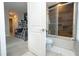 Bright bathroom featuring a glass-enclosed shower and tub combination adjacent to the ' bunk room at 7572 Sunny Dreams Ln, Kissimmee, FL 34747