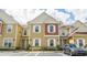 Inviting two-story townhouse with neutral color palette and attached front-entry parking at 7572 Sunny Dreams Ln, Kissimmee, FL 34747