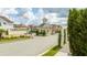 Welcoming gated entrance to the community, showcasing manicured landscaping and controlled access at 7572 Sunny Dreams Ln, Kissimmee, FL 34747