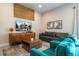 Cozy living room featuring stylish decor, plush seating, and a large-screen TV at 7572 Sunny Dreams Ln, Kissimmee, FL 34747