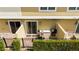 Outdoor patio featuring a built-in grill, stone countertop, and private fence at 7572 Sunny Dreams Ln, Kissimmee, FL 34747