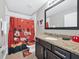 Themed bathroom featuring bright colors, themed decor, and essential amenities at 8215 Roseville Blvd, Davenport, FL 33896