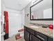 bathroom featuring themed decor, a single vanity, and a shower-tub combination at 8215 Roseville Blvd, Davenport, FL 33896