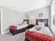 Bright bedroom with two twin beds, themed bedding, and simple decor at 8215 Roseville Blvd, Davenport, FL 33896