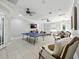 Bright common room featuring a ping pong table, plush sofas, and a large television at 8215 Roseville Blvd, Davenport, FL 33896