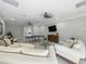 Relax in the common room, complete with ping pong table, sofas, and a television at 8215 Roseville Blvd, Davenport, FL 33896