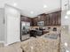 Well-equipped kitchen featuring stainless steel appliances and granite countertops at 8215 Roseville Blvd, Davenport, FL 33896