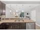 Kitchen featuring stainless steel appliances and a view into the living room at 8215 Roseville Blvd, Davenport, FL 33896