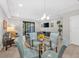 Bright living area with a glass dining table and sliding doors at 8215 Roseville Blvd, Davenport, FL 33896