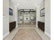 Spacious lobby with fireplace, elegant chandelier, tile floor and dark wood cabinets at 8215 Roseville Blvd, Davenport, FL 33896