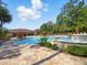 Community pool with a spa, water features, chairs and umbrellas, for a resort-like feel at 8215 Roseville Blvd, Davenport, FL 33896