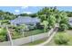 Aerial view of backyard with pool, screened lanai, and privacy fence at 8713 S Bay Dr, Orlando, FL 32819