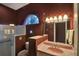 This traditional bathroom showcases a walk-in shower, and arched window for natural light and style at 8713 S Bay Dr, Orlando, FL 32819