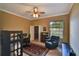 Bedroom with desk and reading chair, plus a view into an adjoining walk-in closet at 8713 S Bay Dr, Orlando, FL 32819