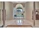 Elegant foyer with marble flooring, soaring ceilings, and a grand arched entrance at 8713 S Bay Dr, Orlando, FL 32819