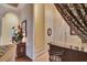 Hallway with tile flooring and a bar counter featuring decorative curtains and interior doors at 8713 S Bay Dr, Orlando, FL 32819