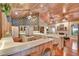 Spacious open kitchen with wood countertops, a central island cooktop, and hardwood floors at 8713 S Bay Dr, Orlando, FL 32819