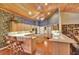 Large kitchen with wooden cabinets, central island cooktop, breakfast bar and lots of natural light at 8713 S Bay Dr, Orlando, FL 32819