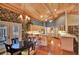 The kitchen is well-equipped with a cooktop island, light wood cabinets, breakfast bar, and dining area at 8713 S Bay Dr, Orlando, FL 32819