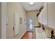 Bright laundry room featuring a washer and dryer, utility sink, storage cabinets, and convenient exterior access at 8713 S Bay Dr, Orlando, FL 32819