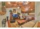 Living room featuring a vaulted wood ceiling and views to the open kitchen with a breakfast bar at 8713 S Bay Dr, Orlando, FL 32819