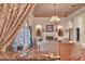 Elegant living room featuring a fireplace, chandelier, and marble bar for luxurious entertaining at 8713 S Bay Dr, Orlando, FL 32819