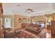A main bedroom with a sitting area, hardwood floors and ensuite bathroom at 8713 S Bay Dr, Orlando, FL 32819
