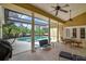 Covered patio area overlooking a pool with ample seating space, ideal for outdoor dining and relaxation at 8713 S Bay Dr, Orlando, FL 32819
