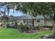 Outdoor screened lanai and pool area surrounded by lush landscaping at 8713 S Bay Dr, Orlando, FL 32819
