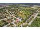 Homes in a neighborhood featuring verdant landscapes and mature trees, with calming lakes in the distance at 896 Satin Leaf Cir, Ocoee, FL 34761