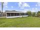 Backyard view featuring a screened patio and a fenced perimeter at 896 Satin Leaf Cir, Ocoee, FL 34761