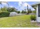Well-maintained backyard with lush green grass and partial fencing at 896 Satin Leaf Cir, Ocoee, FL 34761