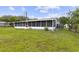 Wide backyard featuring a screened patio area, perfect for outdoor enjoyment at 896 Satin Leaf Cir, Ocoee, FL 34761