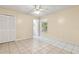 This bedroom has ample closet space, tiled floors, and a ceiling fan at 896 Satin Leaf Cir, Ocoee, FL 34761