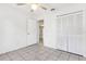 Neutral bedroom with tiled floors, ceiling fan, and a closet at 896 Satin Leaf Cir, Ocoee, FL 34761