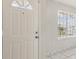 Brightly painted white door and window from the interior of the home at 896 Satin Leaf Cir, Ocoee, FL 34761