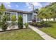 Close up view of the front of the home with well kept landscaping and a walkway to the front door at 896 Satin Leaf Cir, Ocoee, FL 34761