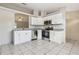 Bright kitchen features stainless steel appliances, granite countertops, and a serving hatch at 896 Satin Leaf Cir, Ocoee, FL 34761
