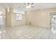 Large living room with tiled floors, recessed lighting, and opening to kitchen area at 896 Satin Leaf Cir, Ocoee, FL 34761