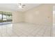 Bright living room with tile flooring and sliding glass doors to lanai area at 896 Satin Leaf Cir, Ocoee, FL 34761